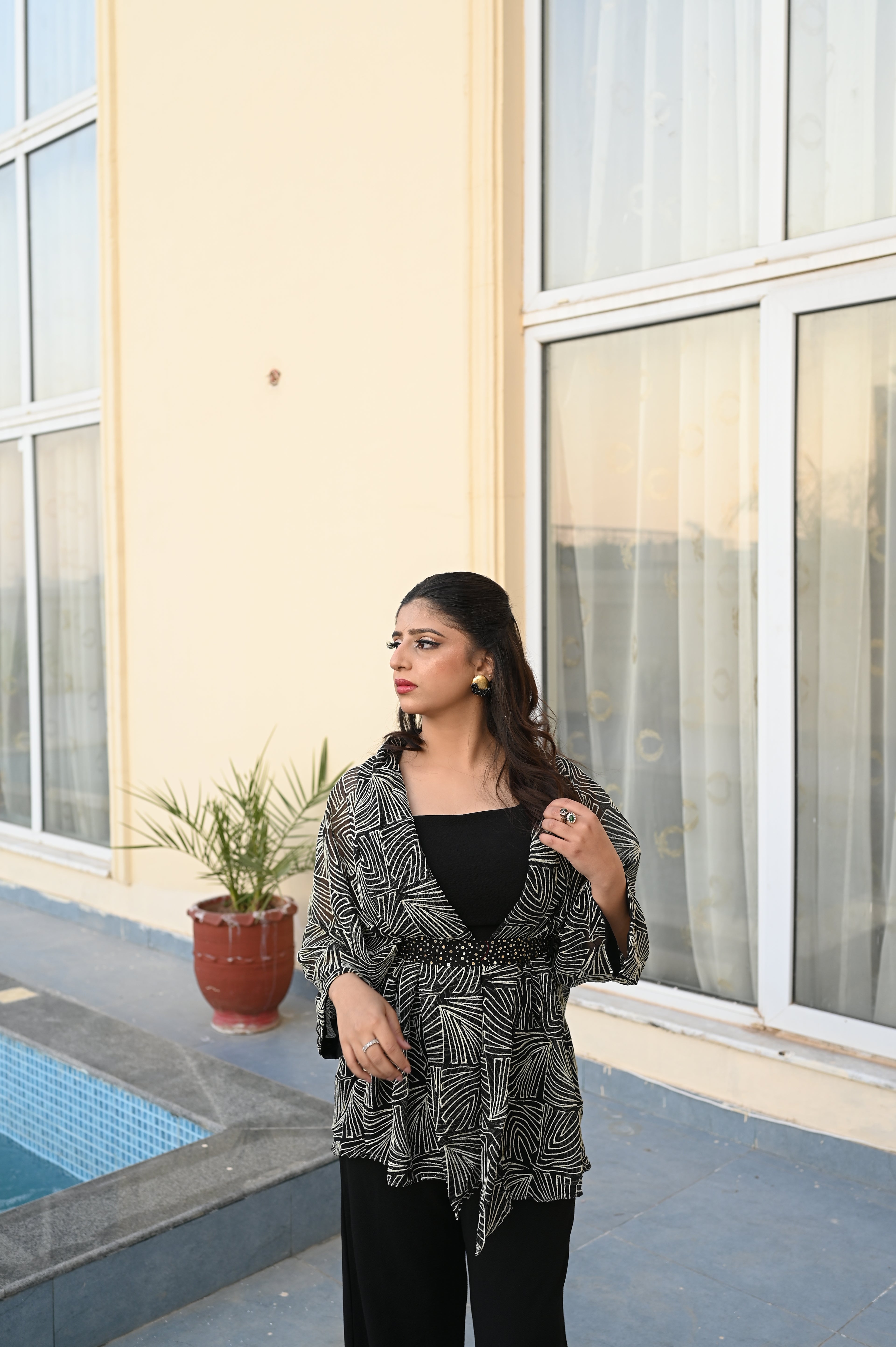 Noir Majesty – Contemporary Black Jumpsuit with Cape & Embellished Belt