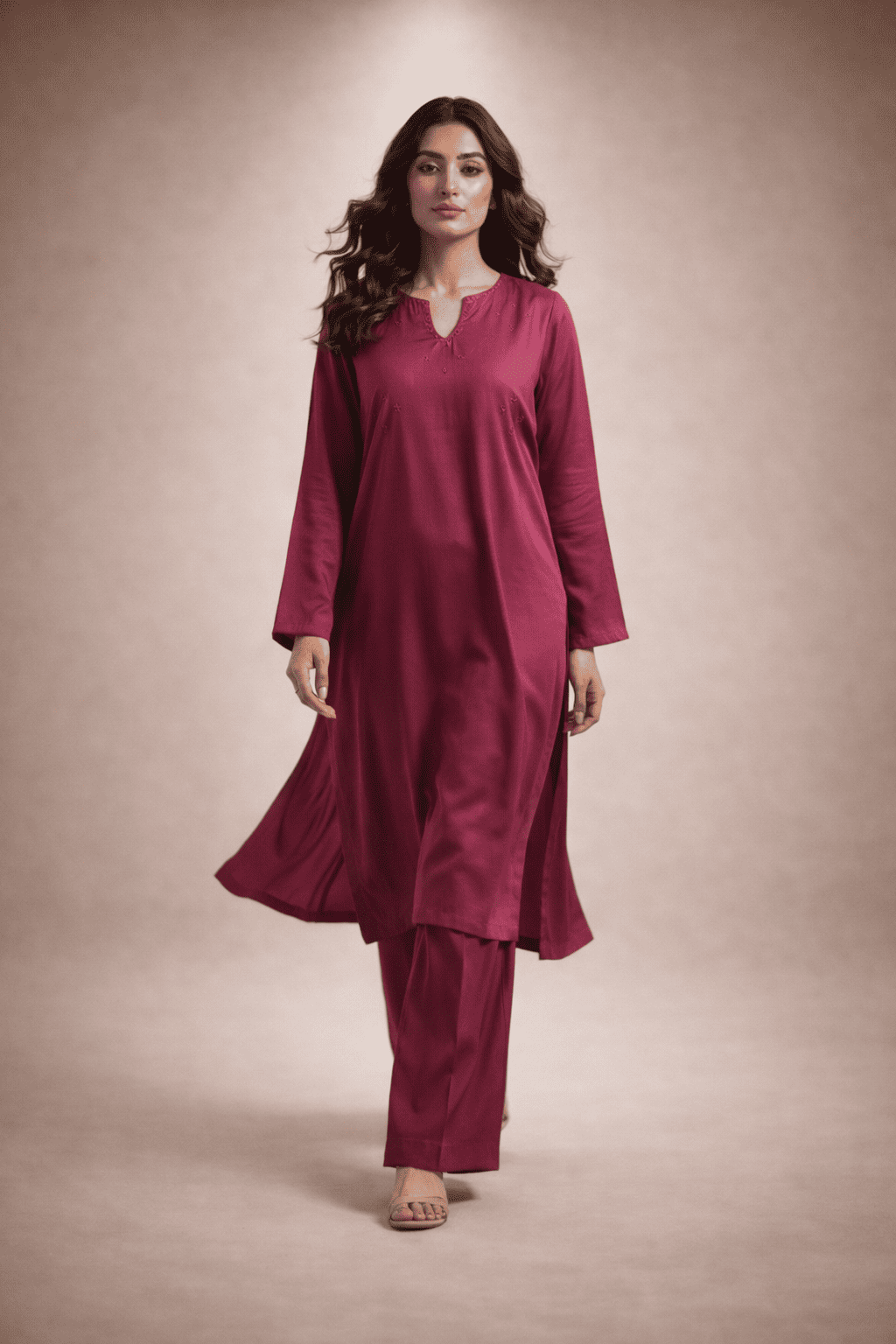 Pakistani woman model wearing elegant deep pink winter kurta with matching trousers, minimalist studio background, premium stitched pret outfit